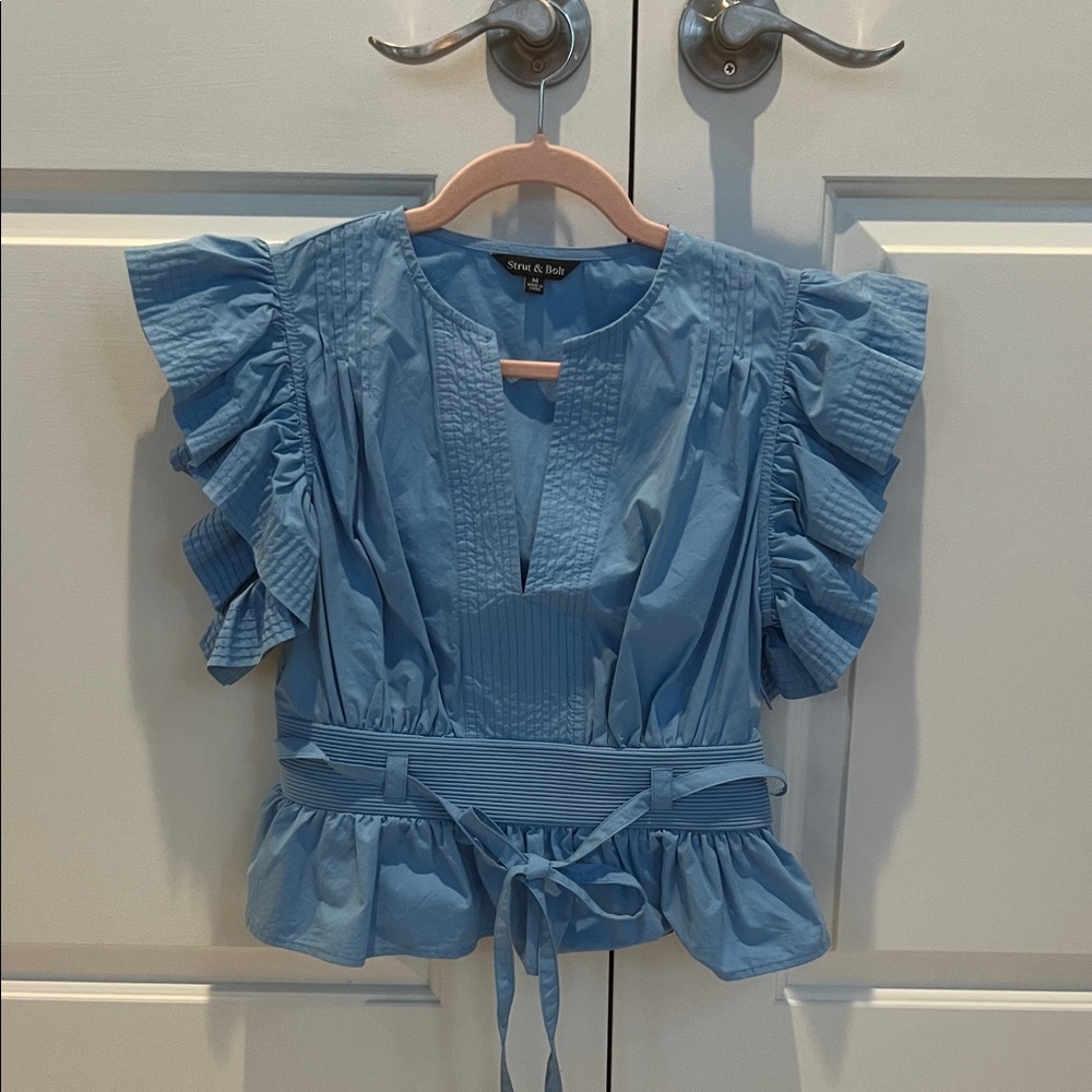Strut  and bolt Blue Ruffled Top